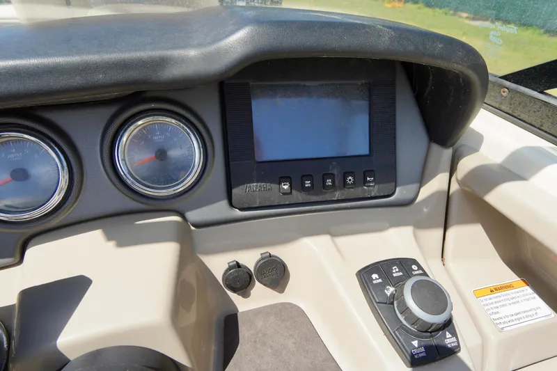 Slide: The Image of Dashboard of 2015 Yamaha Boats 242 Limited S with gauges and controls. - 21