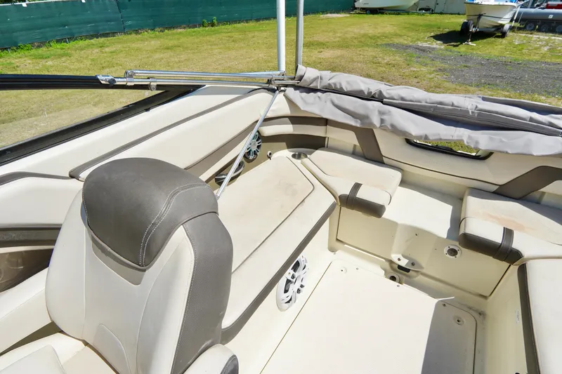 Slide: The Image of 2015 Yamaha Boats 242 Limited S interior with beige seating and open deck. - 22