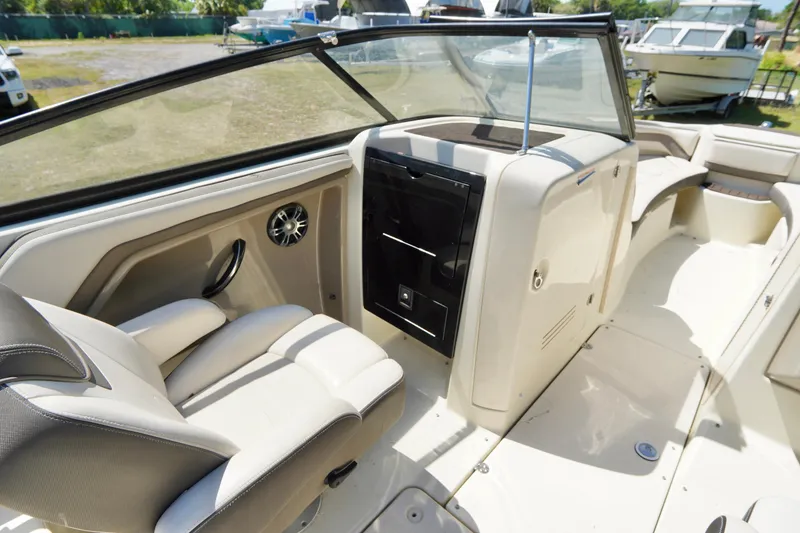 Slide: The Image of 2015 Yamaha Boats 242 Limited S interior with seating and dashboard view. - 27