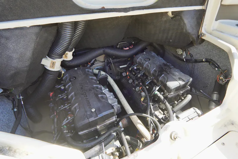 Slide: The Image of Engine compartment of a 2015 Yamaha Boats 242 Limited S, showcasing dual engines and wiring. - 30
