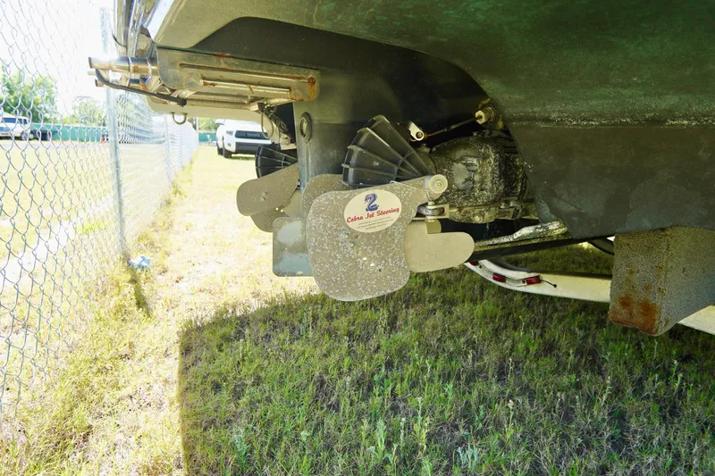 Slide: The Image of Rear view of a 2015 Yamaha Boats 242 Limited S, showing the jet drive system. - 33