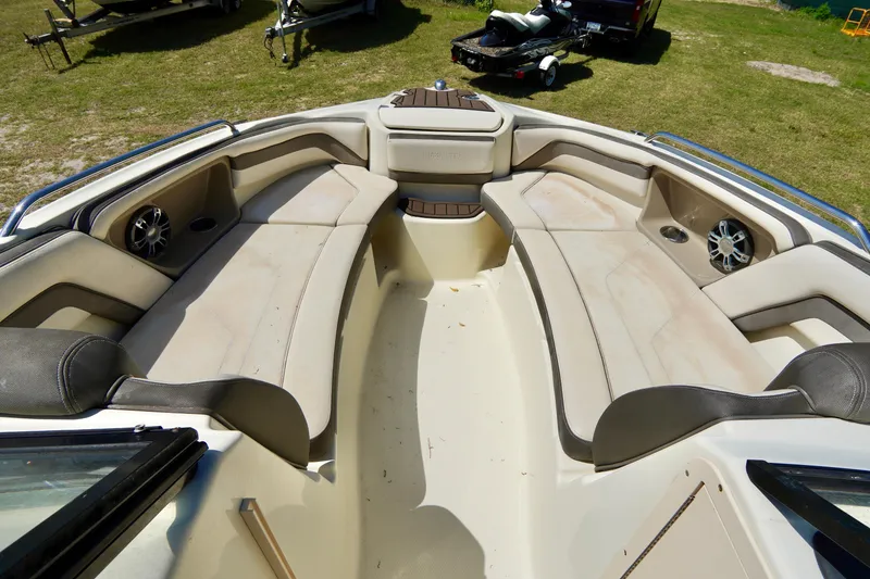 Slide: The Image of 2015 Yamaha Boats 242 Limited S interior with spacious seating and speakers. - 7