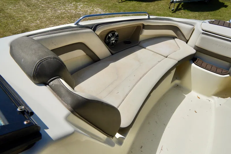 Slide: The Image of 2015 Yamaha Boats 242 Limited S interior seating with speaker, showcasing comfort and style. - 9