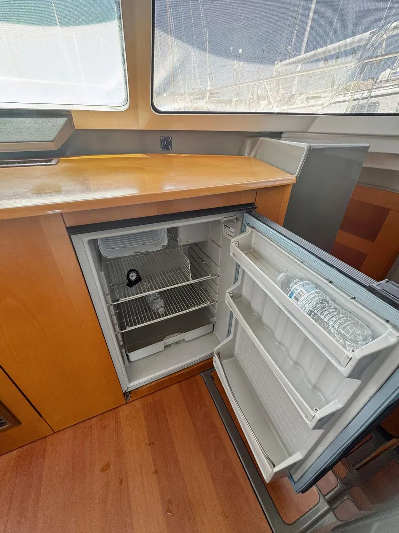 Slide: The Image of Interior of 2005 Fountaine Pajot HIGHLAND yacht with cozy seating and wooden table. - 25