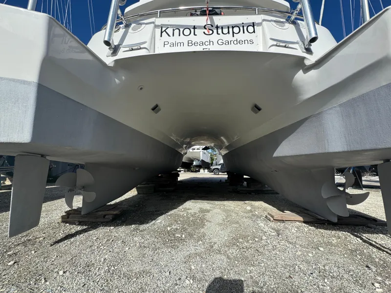 Slide: The Image of 2005 Fountaine Pajot HIGHLAND catamaran on dry dock, showing hull and propellers. - 4
