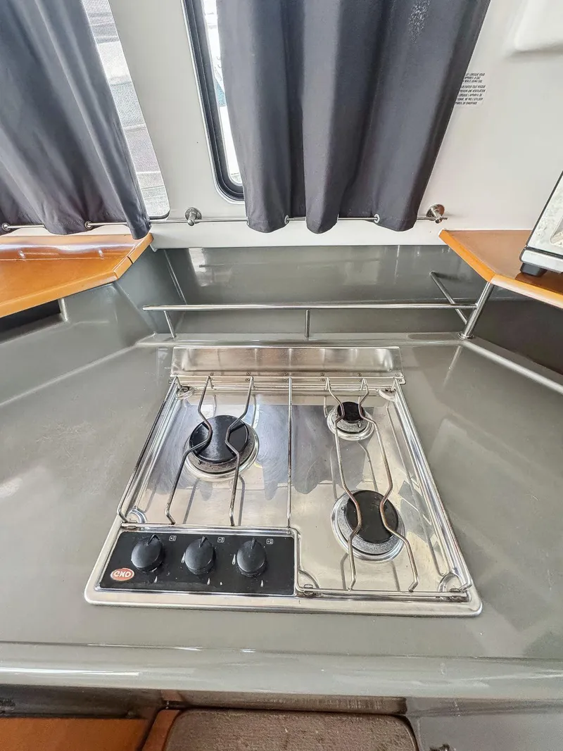 Slide: The Image of Interior view of 2005 Fountaine Pajot HIGHLAND boat with large windows and wooden cabinetry. - 29