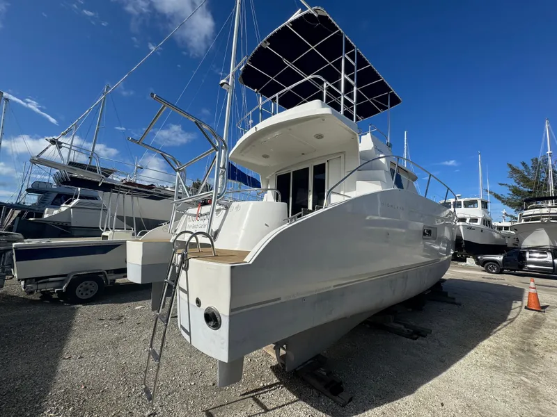 Slide: The Image of 2005 Fountaine Pajot HIGHLAND yacht on dry dock under clear blue sky. - 3