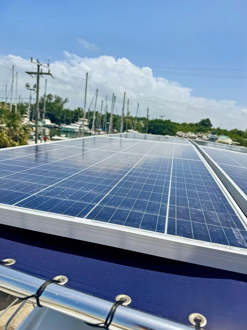 Slide: The Image of ICECO cooler on 2005 Fountaine Pajot HIGHLAND boat deck, with safety equipment nearby. - 43