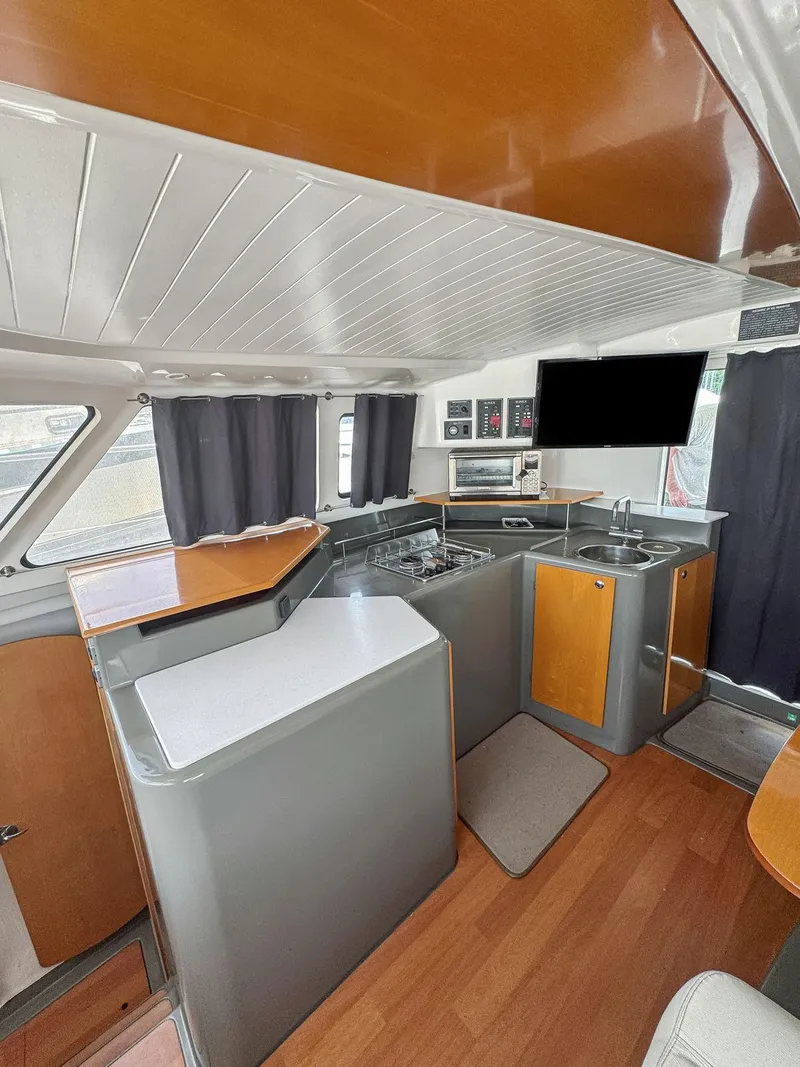 Slide: The Image of 2005 Fountaine Pajot HIGHLAND cabin interior with bed and storage. - 46