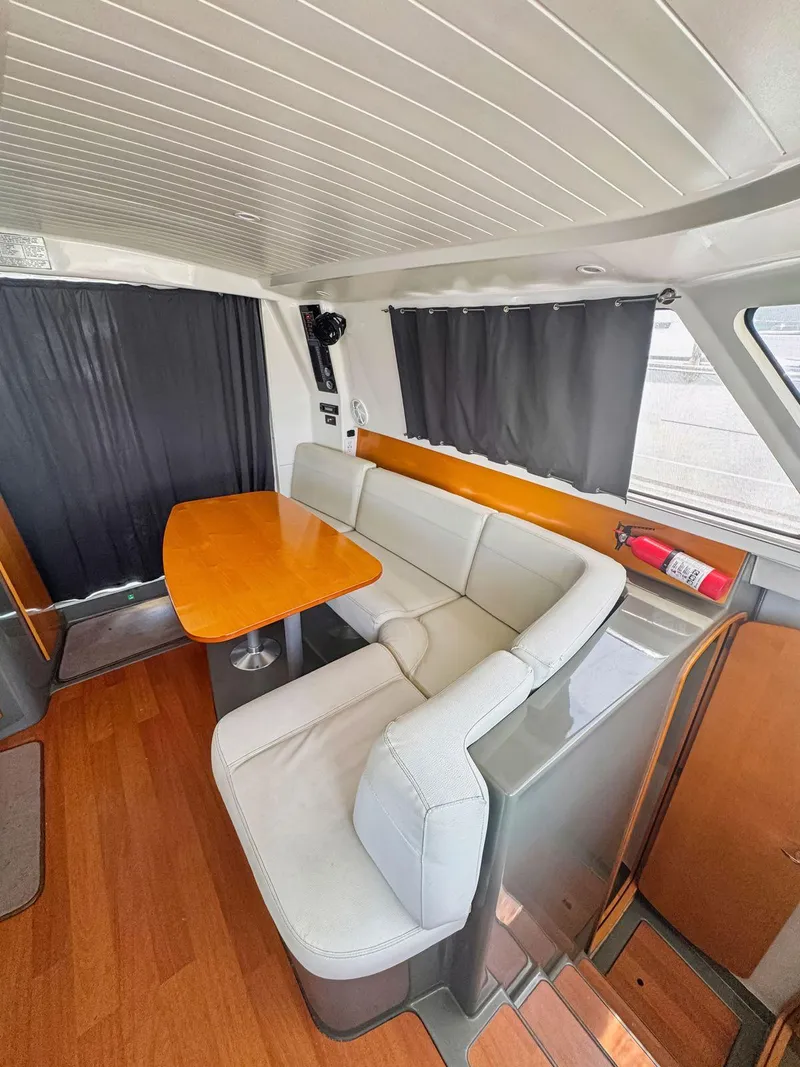 Slide: The Image of 2005 Fountaine Pajot HIGHLAND cabin interior with wooden finish and cozy bed. - 47