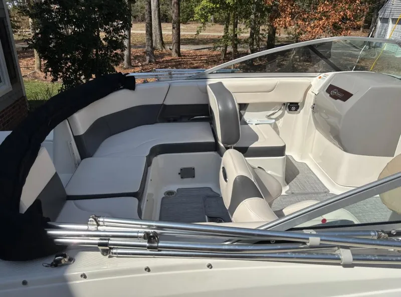 Slide: The Image of 2017 Chaparral 210 Suncoast boat interior with seating and steering console. - 8
