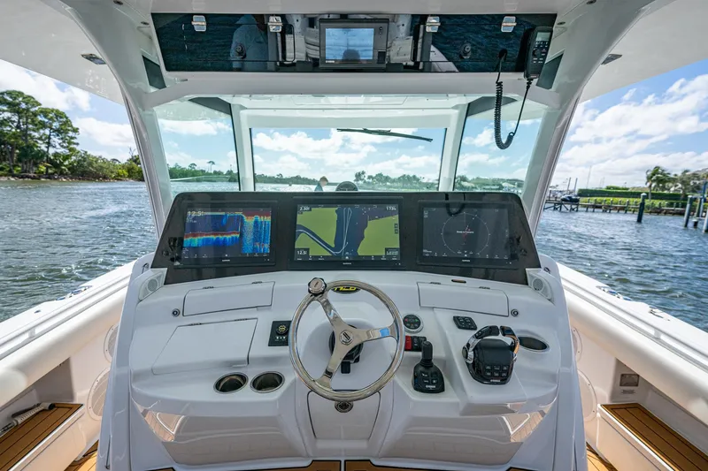 Slide: The Image of Helm of 2020 HCB 53 boat with advanced navigation displays and controls. - 7