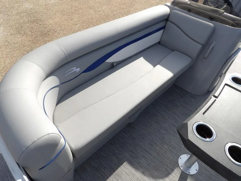 Slide: The Image of 2023 Bennington 20 SVSR boat interior with gray seating and cup holders. - 11
