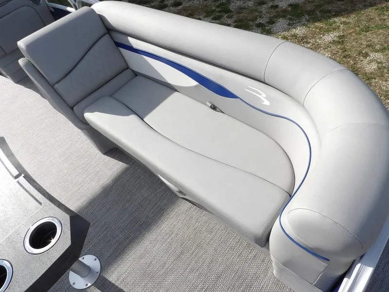 Slide: The Image of 2023 Bennington 20 SVSR boat interior with gray seating and blue accents. - 12