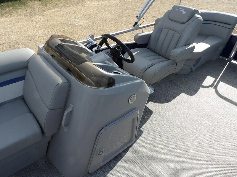 Slide: The Image of 2023 Bennington 20 SVSR boat interior with gray seating and steering console. - 14