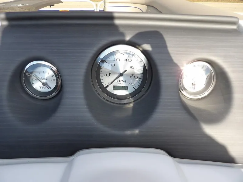 Slide: The Image of Dashboard gauges of 2023 Bennington 20 SVSR boat, showing RPM and trim indicators. - 17