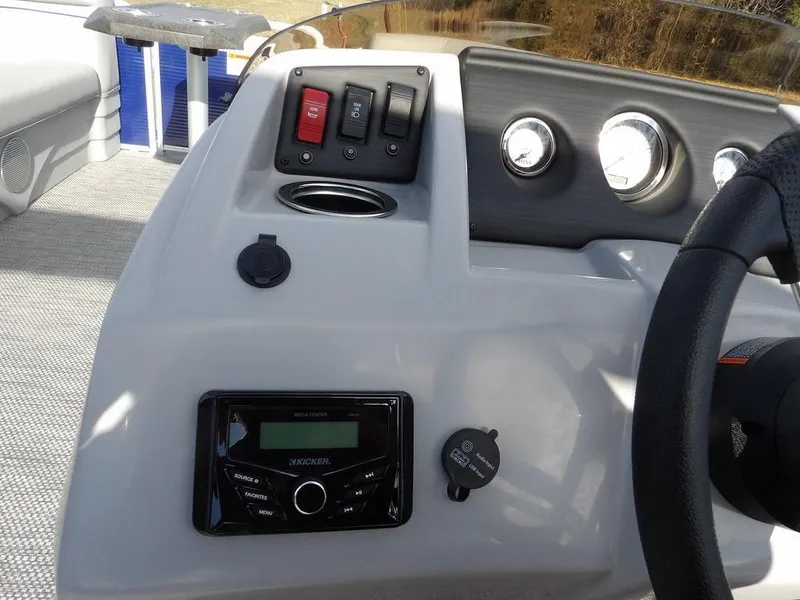 Slide: The Image of 2023 Bennington 20 SVSR boat dashboard with controls and gauges. - 18