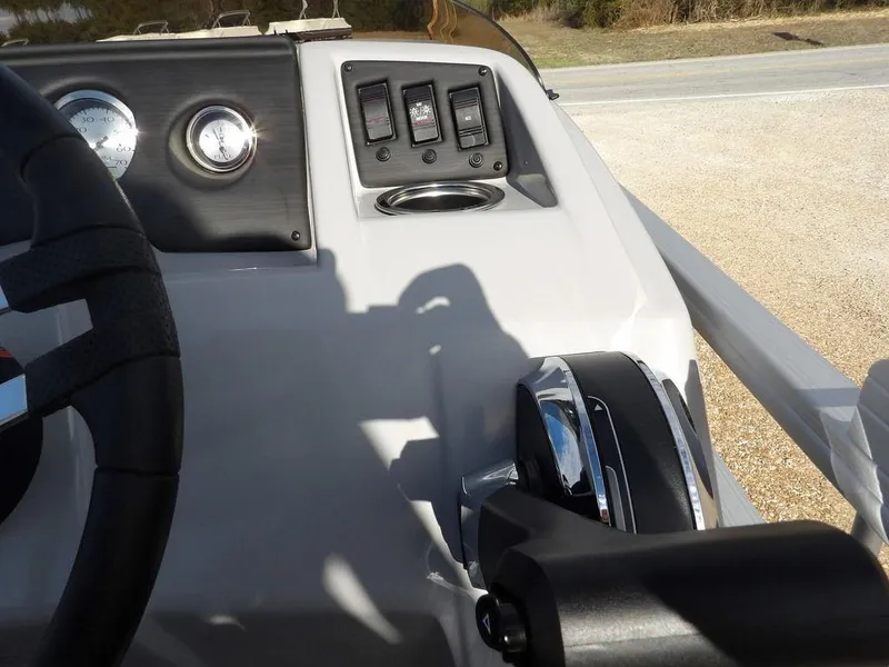 Slide: The Image of 2023 Bennington 20 SVSR boat dashboard with steering wheel and control panel. - 19