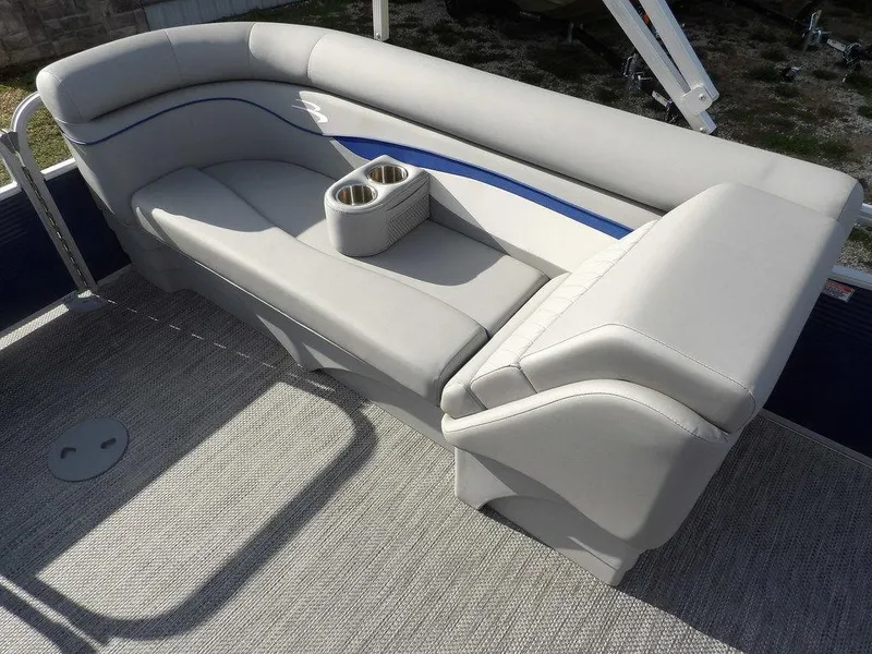 Slide: The Image of 2023 Bennington 20 SVSR boat seating with cup holders, featuring sleek gray upholstery. - 21