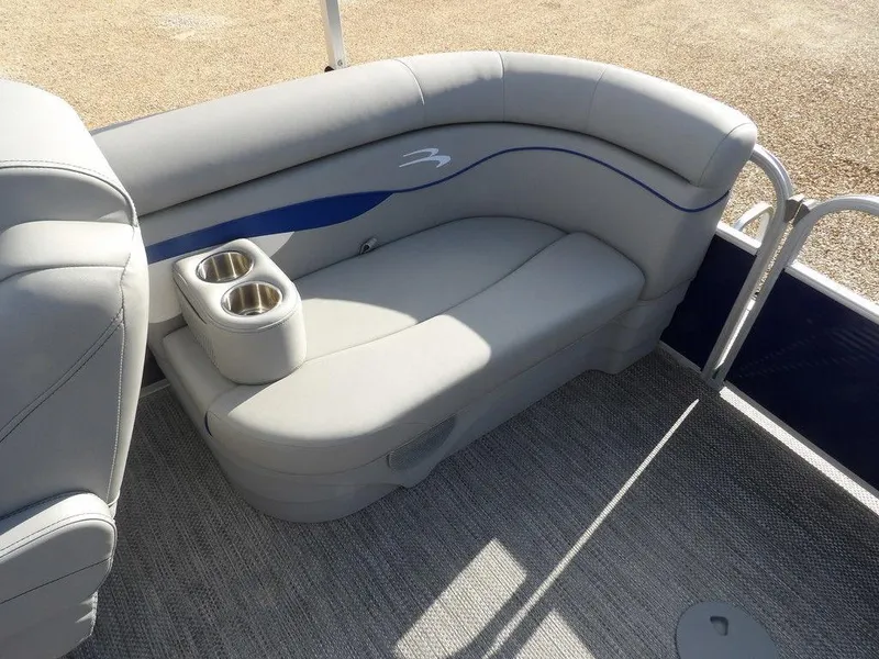Slide: The Image of 2023 Bennington 20 SVSR boat interior with gray seating and cup holders. - 22