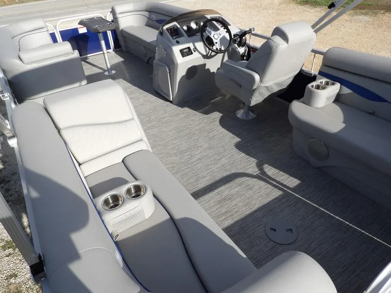 Slide: The Image of 2023 Bennington 20 SVSR pontoon boat interior with plush seating and modern helm. - 24