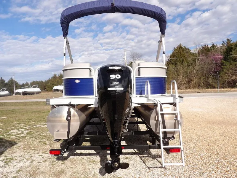 Slide: The Image of 2023 Bennington 20 SVSR pontoon boat with 90 HP engine, rear view. - 7