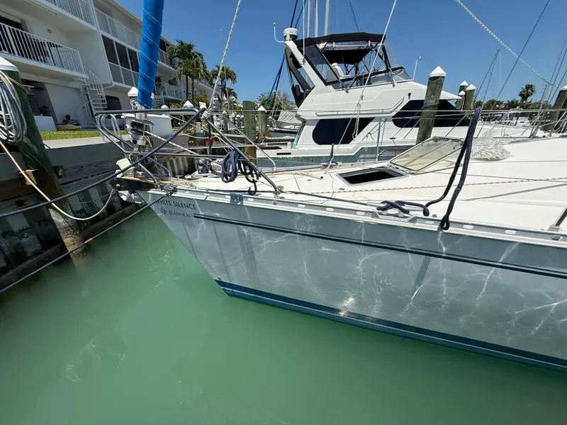 Slide: The Image of 1998 Jeanneau Sun Odyssey 42.2 sailboat docked in marina, clear water, sunny day. - 17