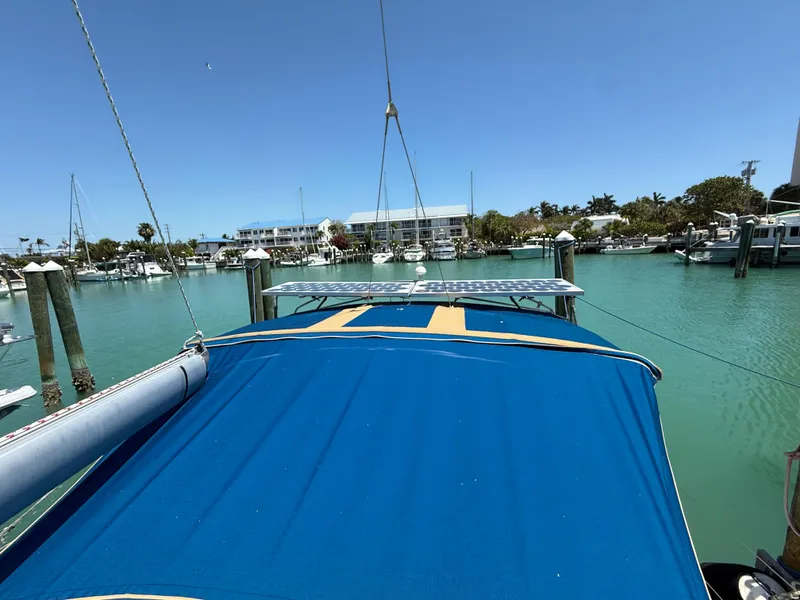 Slide: The Image of Jeanneau Sun Odyssey 42.2 sailboat docked in a sunny marina, 1998 model. - 20