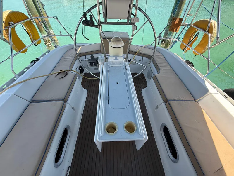 Slide: The Image of Cockpit of 1998 Jeanneau Sun Odyssey 42.2 sailboat with seating and steering wheel. - 33