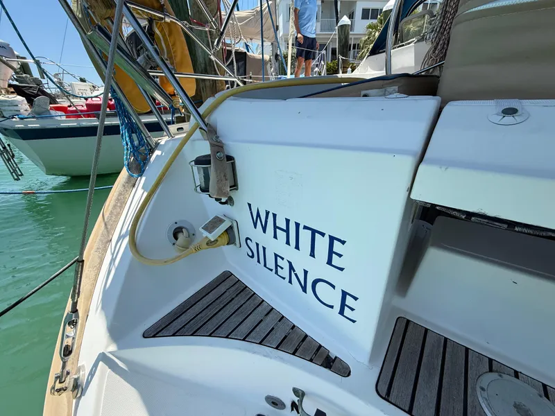 Slide: The Image of Jeanneau Sun Odyssey 42.2 sailboat, 1998, named "White Silence" docked at marina. - 34
