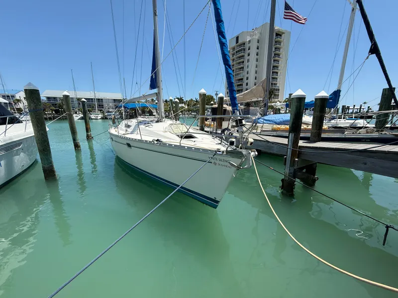 Slide: The Image of Jeanneau Sun Odyssey 42.2 sailboat docked in marina, 1998 model. - 9