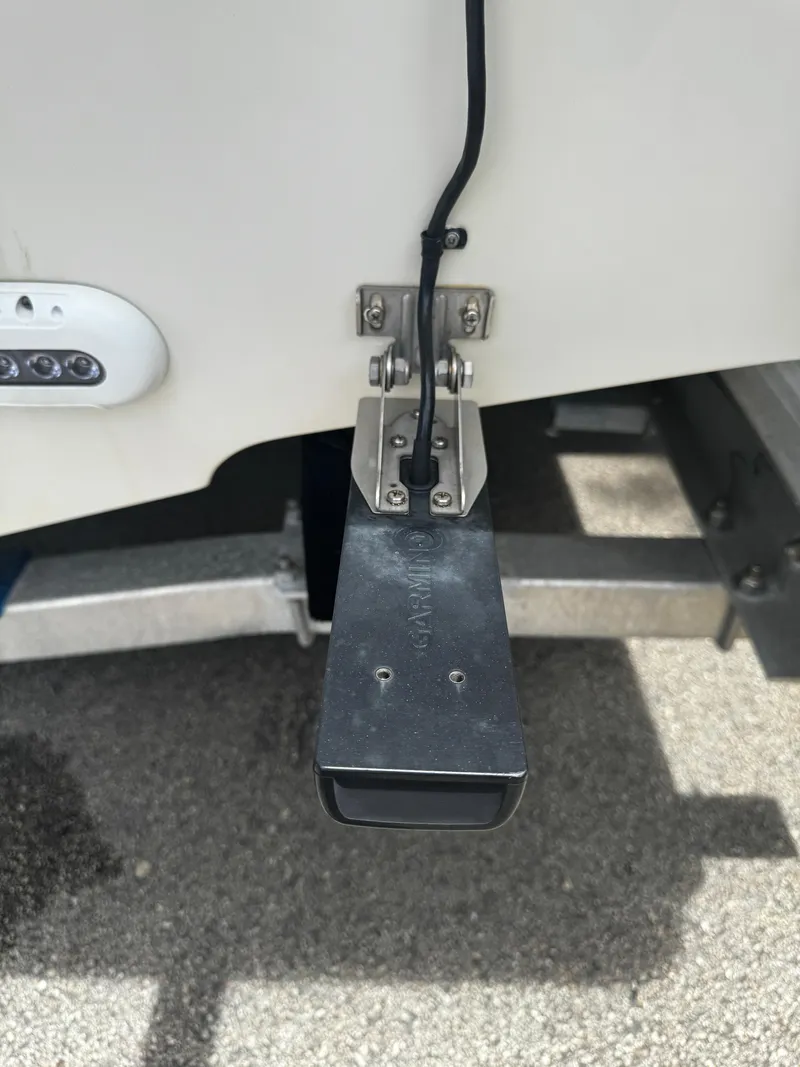 Slide: The Image of 2015 Sailfish 220 CC boat transducer and mounting bracket detail. - 11