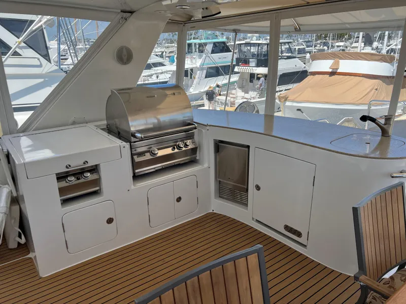 Slide: The Image of Outdoor yacht kitchen with grill and seating, Symbol PHMY 2007 model, docked at marina. - 12
