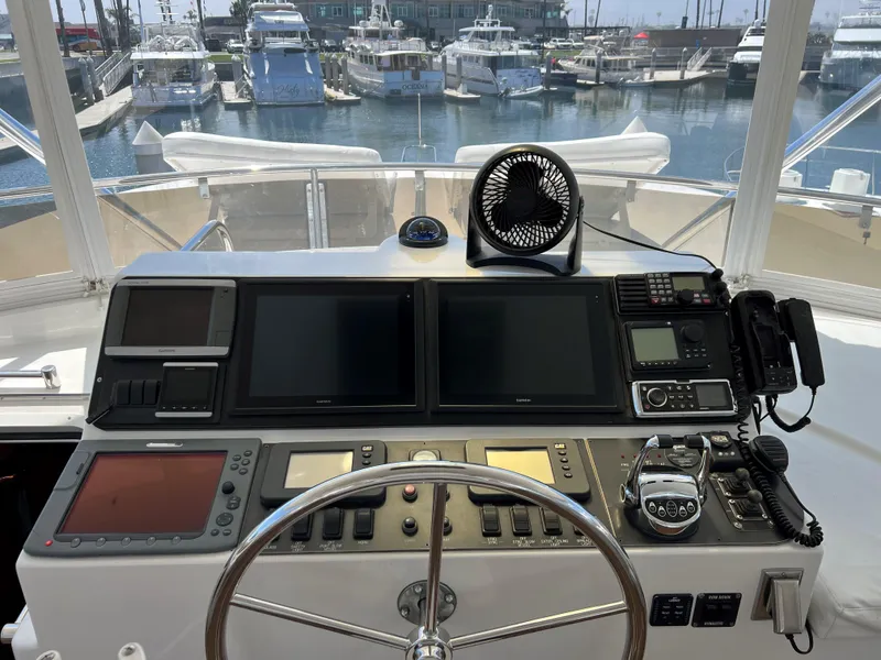 Slide: The Image of Helm of 2007 Symbol PHMY yacht with navigation equipment and marina view. - 14