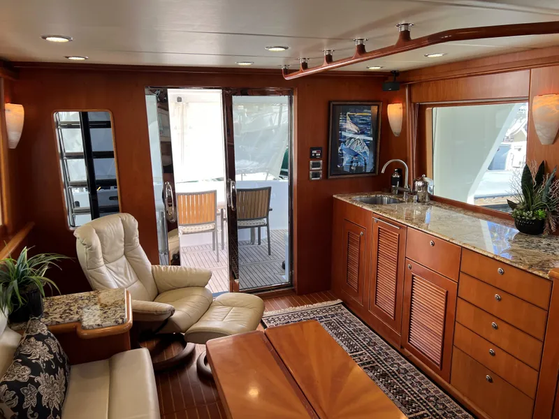 Slide: The Image of Luxurious yacht interior with wooden cabinetry, plush seating, and elegant decor, Symbol PHMY 2007 model. - 3