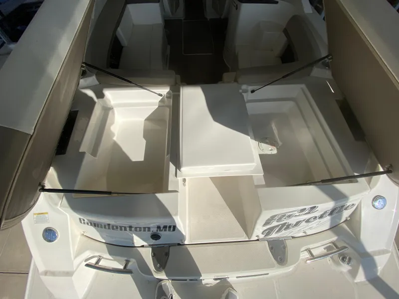 Slide: The Image of 2012 Sea Ray 270 SLX boat interior with open storage compartments. - 14