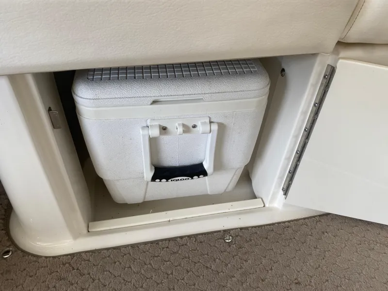 Slide: The Image of White cooler stored in a compartment on a 2012 Sea Ray 270 SLX boat. - 21