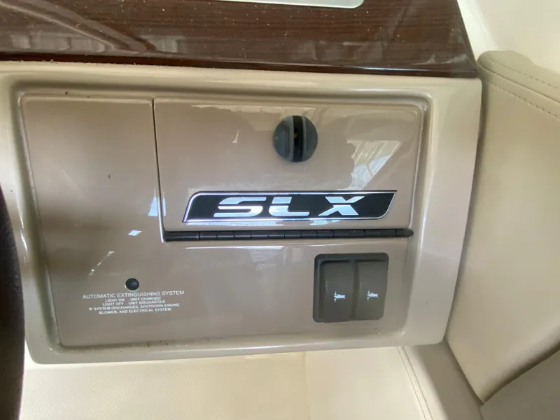 Slide: The Image of Control panel of 2012 Sea Ray 270 SLX boat with SLX branding. - 34