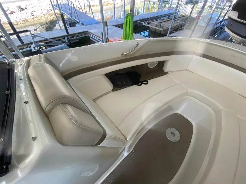 Slide: The Image of Interior view of a 2012 Sea Ray 270 SLX boat with beige seating. - 39