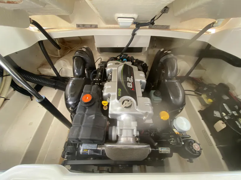 Slide: The Image of Engine compartment of a 2012 Sea Ray 270 SLX boat, showcasing the 8.2L engine. - 44