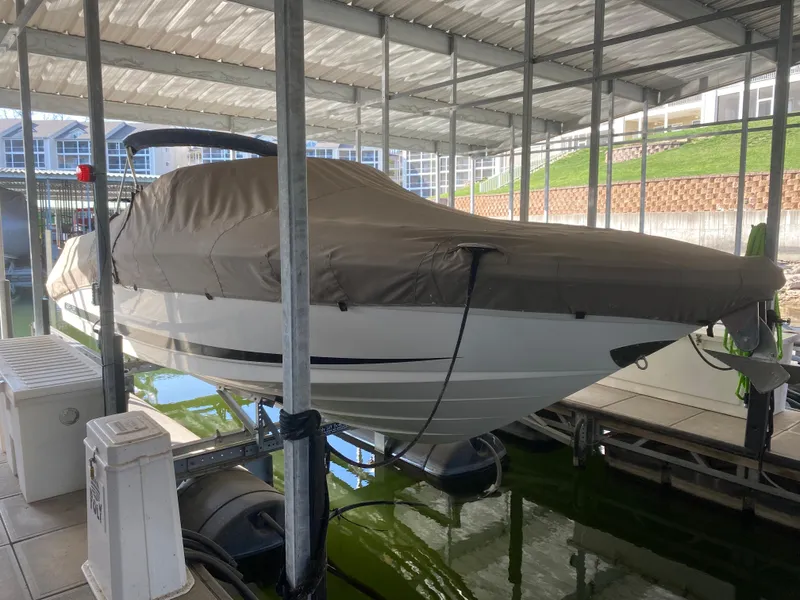 Slide: The Image of Covered 2012 Sea Ray 270 SLX boat docked in a marina. - 47