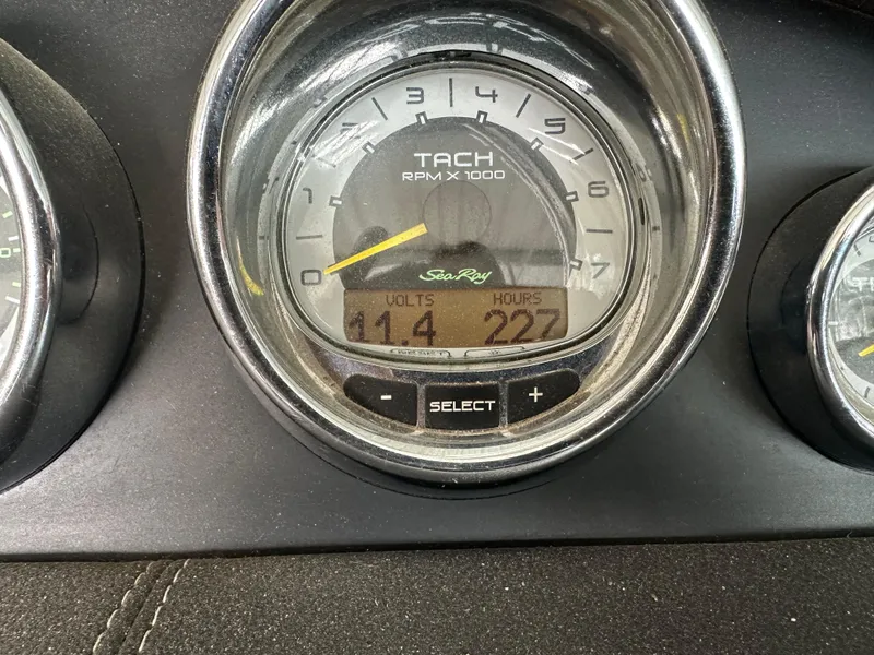 Slide: The Image of Tachometer of 2012 Sea Ray 270 SLX showing RPM, volts, and hours. - 48