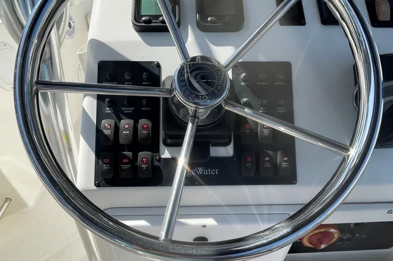 Slide: The Image of Steering wheel of a 2007 Edgewater 228 boat with control panel. - 20