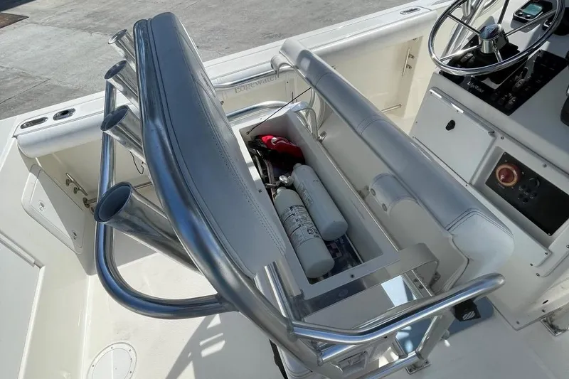 Slide: The Image of Edgewater 228 boat interior with storage compartment and seating, 2007 model. - 22