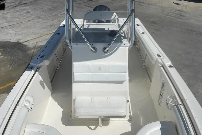 Slide: The Image of 2007 Edgewater 228 boat interior with seating and console, viewed from above. - 4