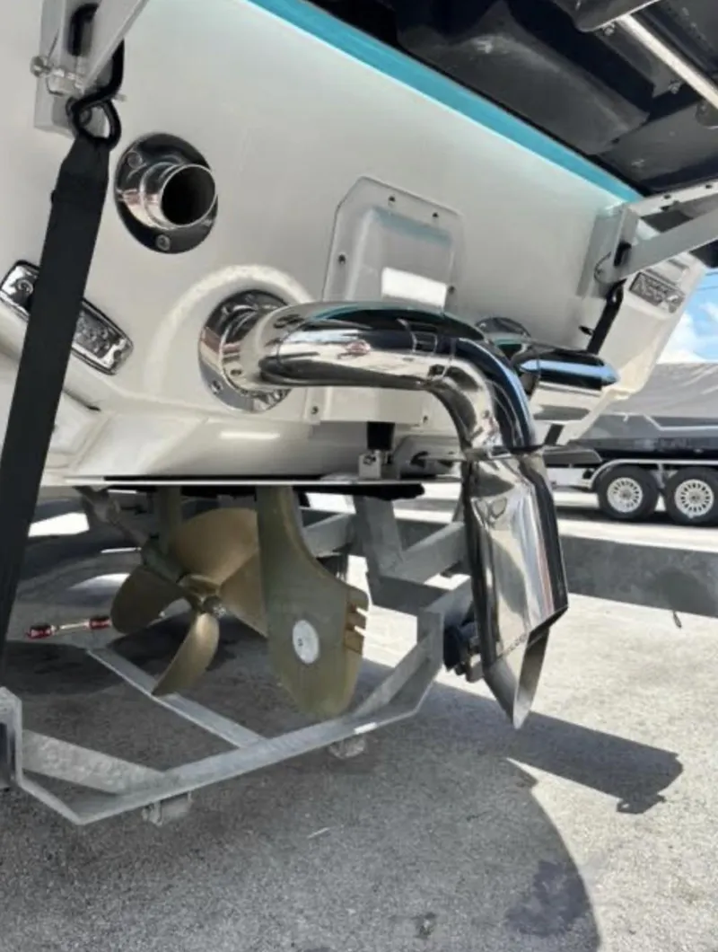 Slide: The Image of 2022 Nautique Super Air Nautique G23 boat exhaust and propeller detail. - 3
