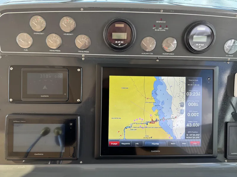 Slide: The Image of Dashboard of a 2000 Tiara Yachts 4000 Express with navigation and control instruments. - 28