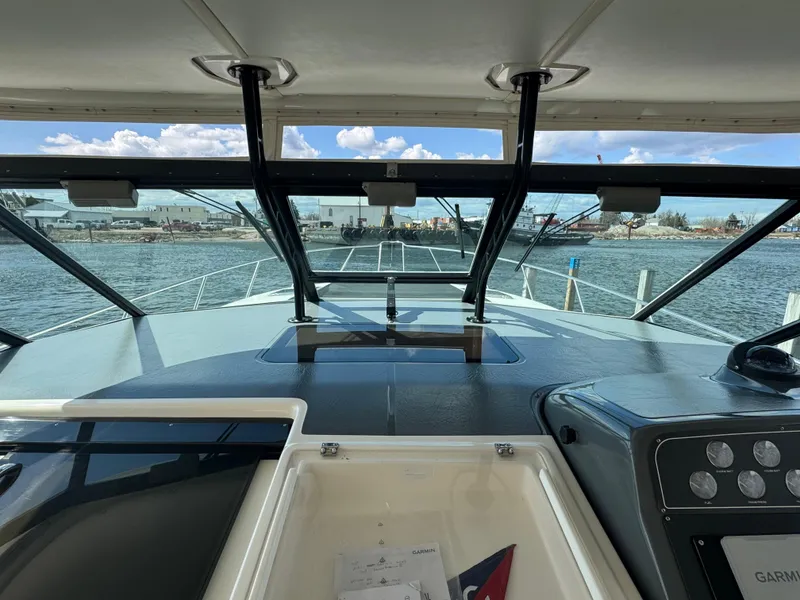 Slide: The Image of Cockpit view of 2000 Tiara Yachts 4000 Express on the water. - 31