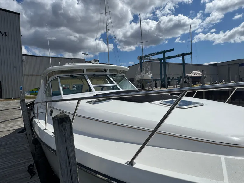 Slide: The Image of 2000 Tiara Yachts 4000 Express docked under cloudy sky. - 33