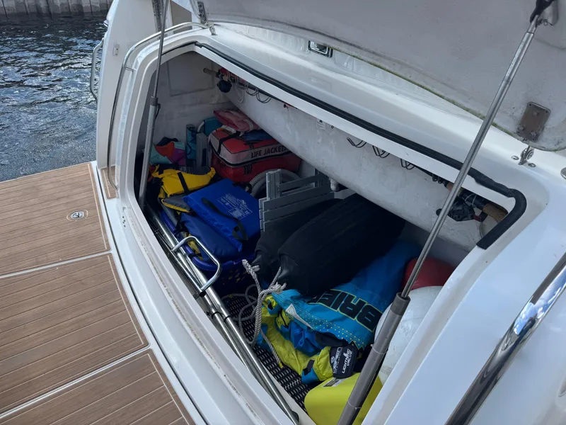 Slide: The Image of Storage compartment of a 2000 Tiara Yachts 4000 Express filled with boating gear. - 34